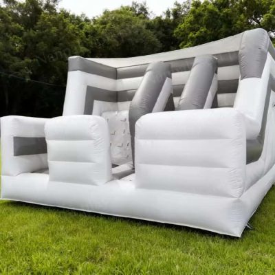 Casa hinchable multifuncional con muro de escalada tobogán hinchable y soplador