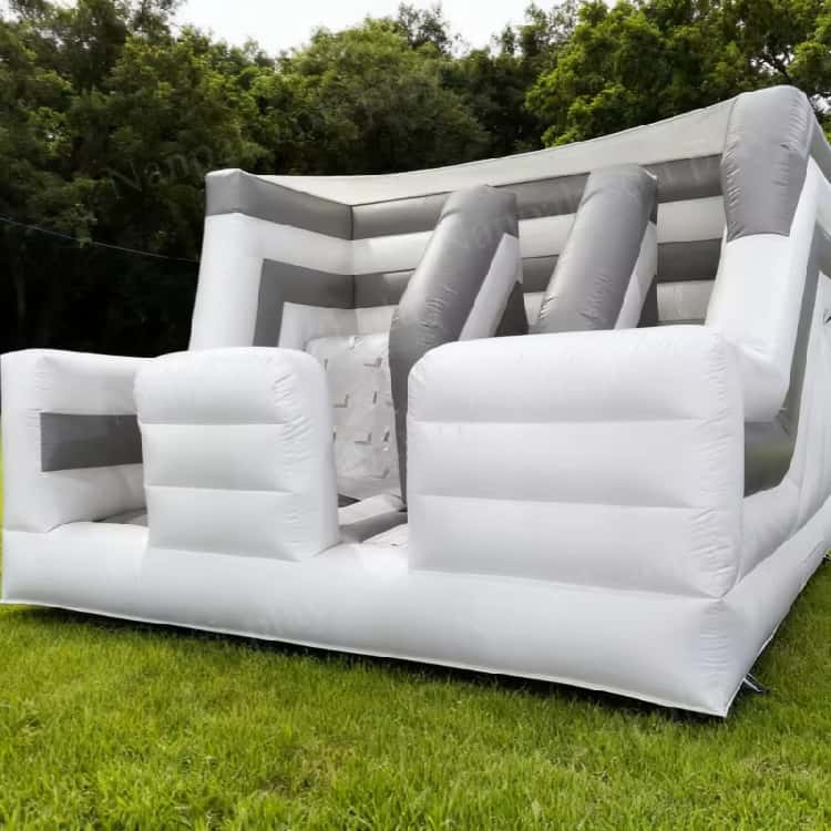 Casa hinchable multifuncional con muro de escalada tobogán hinchable y soplador
